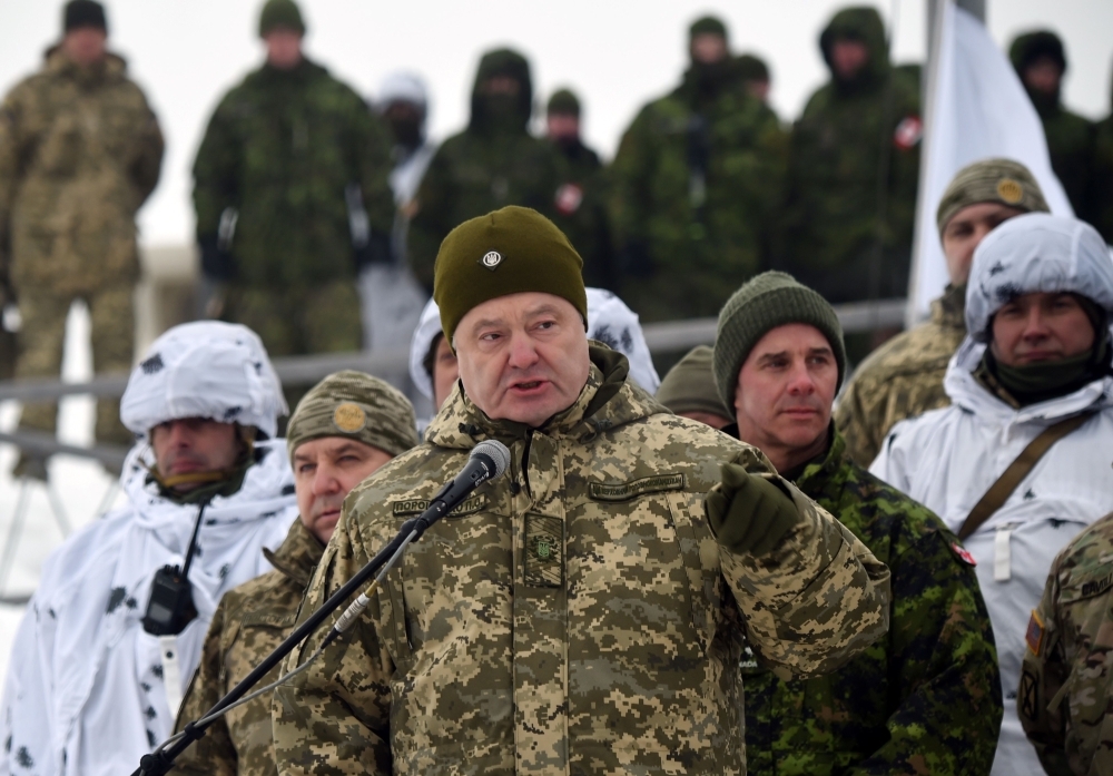 Ukrainian President Petro Poroshenko speaking to the servicemen taking part in brigade tactical exercises near Goncharivske willage, Chernihiv region, not far from the border with Russia, in this Dec. 3, 2018 file photo. — AFP