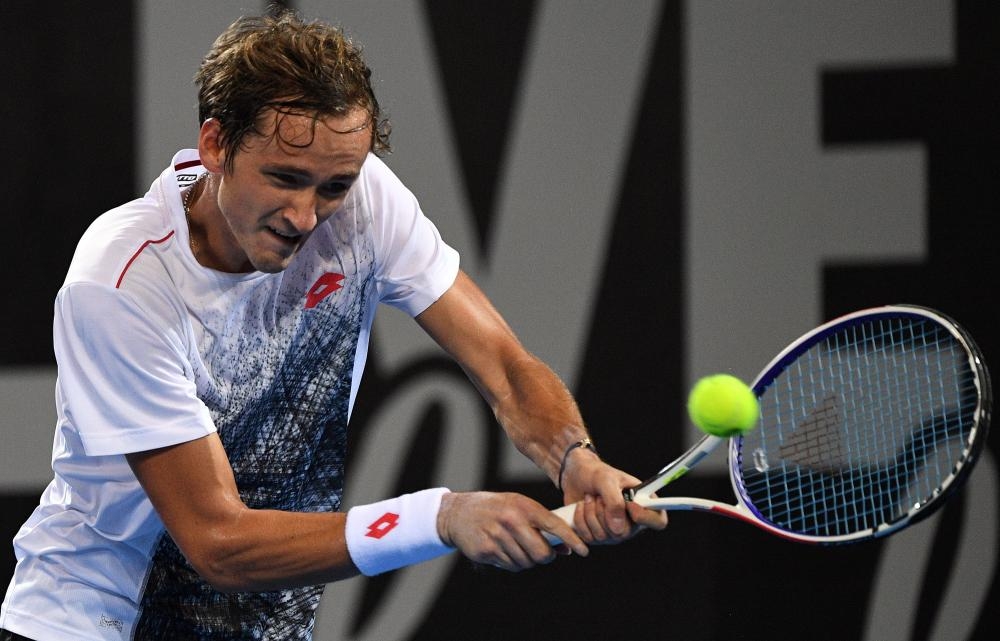 Daniil Medvedev of Russia hits a return against Andy Murray of Britain during their match at the Brisbane International Tennis Tournament Wednesday. — AFP 