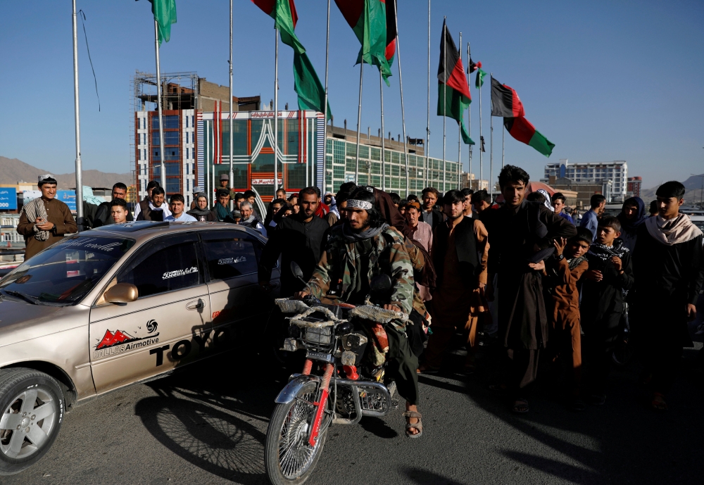 Taliban on a motorbike ride among people in Kabul, Afghanistan, in this June 16, 2018 file photo. — Reuters