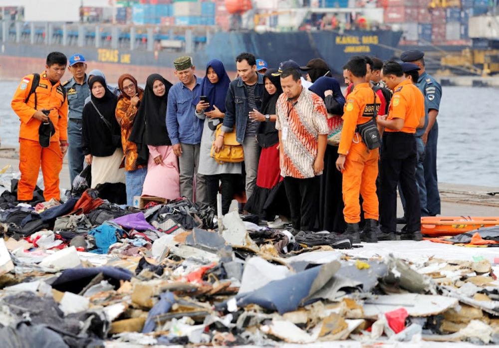 


Families of passengers of Lion Air flight JT610 stand as they look at the belongings of the passengers at Tanjung Priok port in Jakarta, Indonesia, in this Oct. 31 2018 file photo. — Reuters