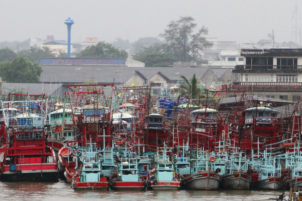 Fishing boats are seen docked at a port as tropical storm Pabuk approaches the southern province of Pattani, Thailand, on Thursday. — Reuters