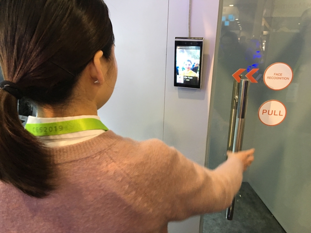 Ella Yuan of the Chinese startup Tuya shows how facial recognition can be used in a home security system to allow or deny entry, at the Consumer Electronics Show in Las Vegas on Wednesday.  — AFP