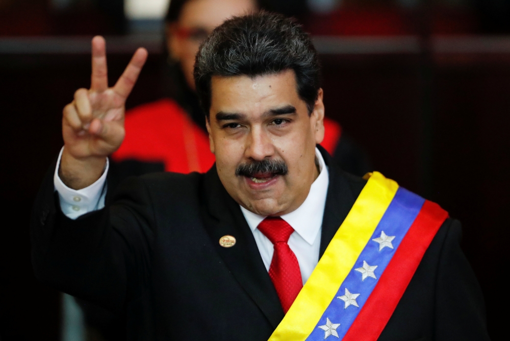 Venezuelan President Nicolas Maduro gestures after receiving the presidential sash during the ceremonial swearing-in for his second presidential term, at the Supreme Court in Caracas, Venezuela, on Thursday. — Reuters