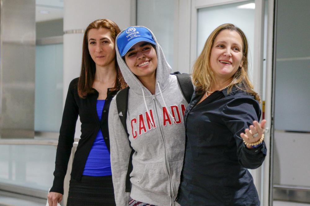 Rahaf Al-Qunun (C) accompanied by Canadian Minister of Foreign Affairs Chrystia Freeland (R) and Saba Abbas, general counsellor of COSTI refugee service agency, arrives at Toronto Pearson International Airport in Toronto, Ontario, Canada on Saturday. — Reuters