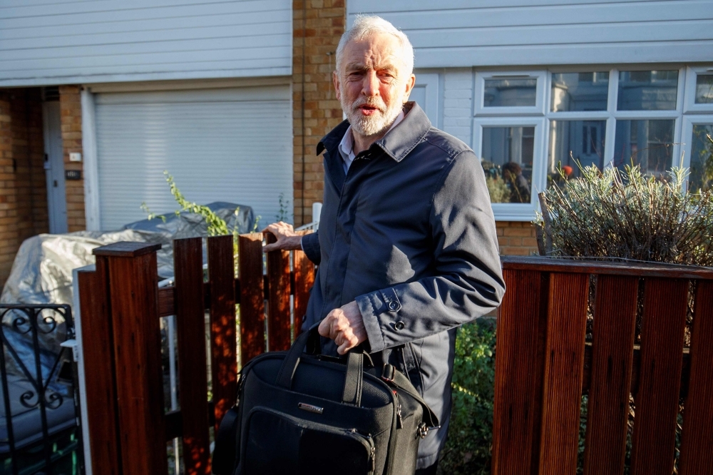 Britain’s main opposition Labour Party leader Jeremy Corbyn leaves his home in London on Monday.