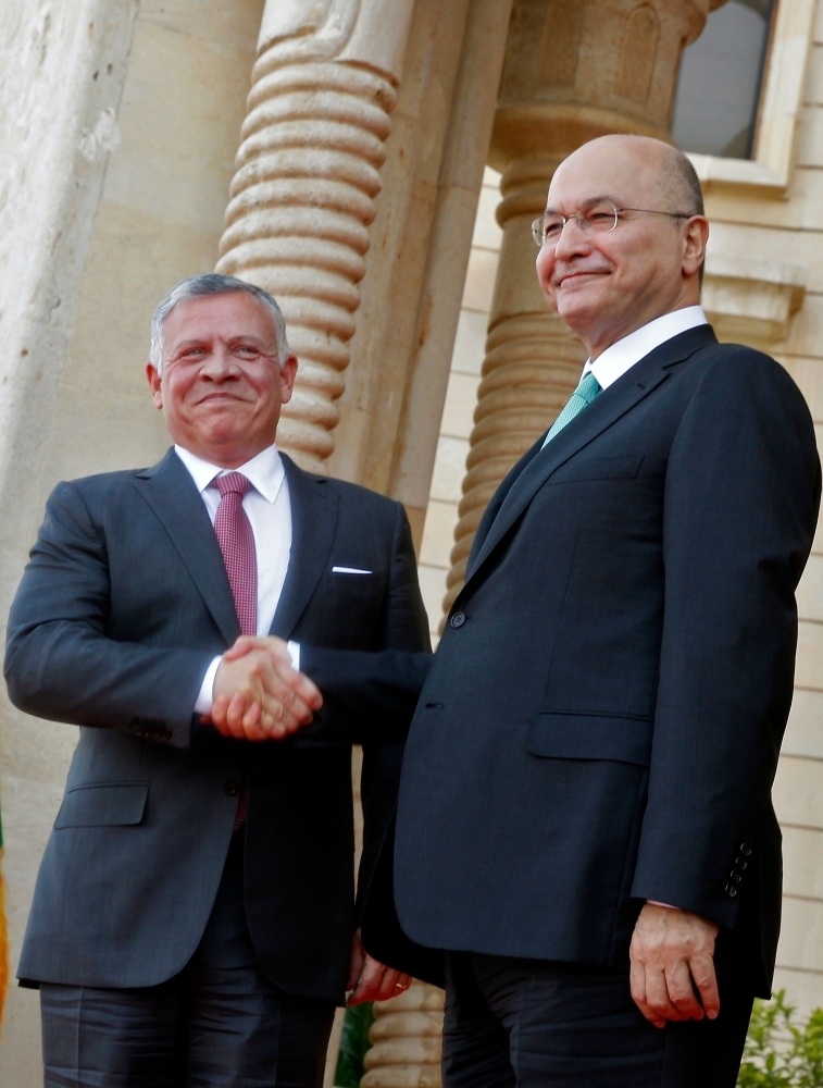 


Iraqi President Barham Saleh (right), receives Jordan’s King Abdullah II in Baghdad, Monday. — AFP