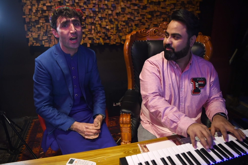 Afghan singer finds fame as Trudeau's double