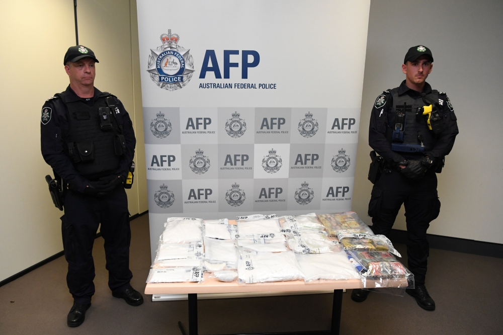 Seized drugs and money are seen at the Australian Federal Police headquarters in Melbourne, Australia, on Wednesday. — Reuters