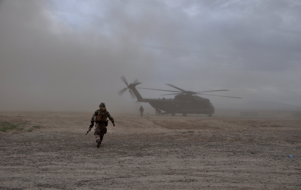 A soldier walks toward a CH-53 helicopter in Kunduz, Afghanistan, in this March 27, 2017 file photo. — Reuters