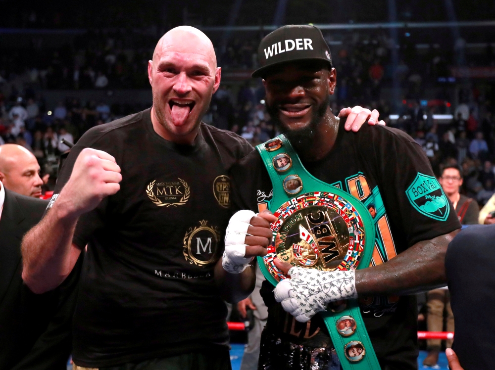 Deontay Wilder and Tyson Fury after the WBC World Heavyweight title fight at the Staples Centre, Los Angeles, United States in this recent photo. — Reuters