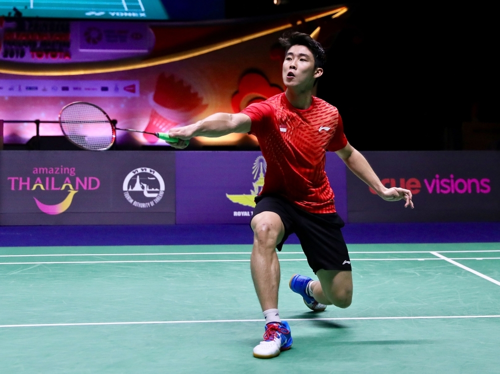 This handout photo shows Singapore's Loh Kean Yew making a return against China's Lin Dan during the men's single finals of Thailand Masters in Bangkok. Rising Singapore badminton star Loh Kean Yew has his sights set on a place at the Tokyo Olympics after a stunning victory against Chinese great Dan in Thailand. — AFP