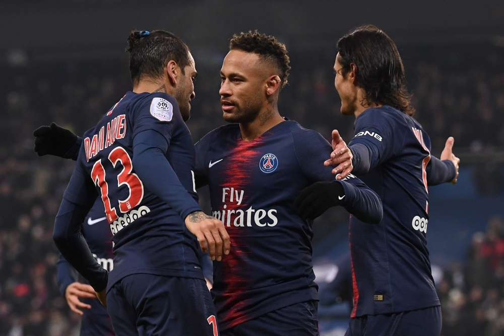 


Paris Saint-Germain’s Neymar is congratulated by teammates after scoring a goal during the French L1 football match against Guingamp at the Parc des Princes Stadium in Paris Saturday. — AFP 