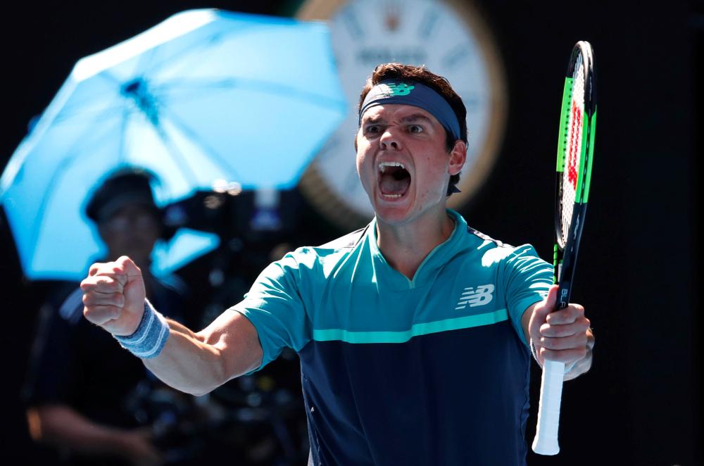 Canada’s Milos Raonic celebrates winning his match against Germany’s Alexander Zverev at the Australian Open in Melbourne Monday. — Reuters