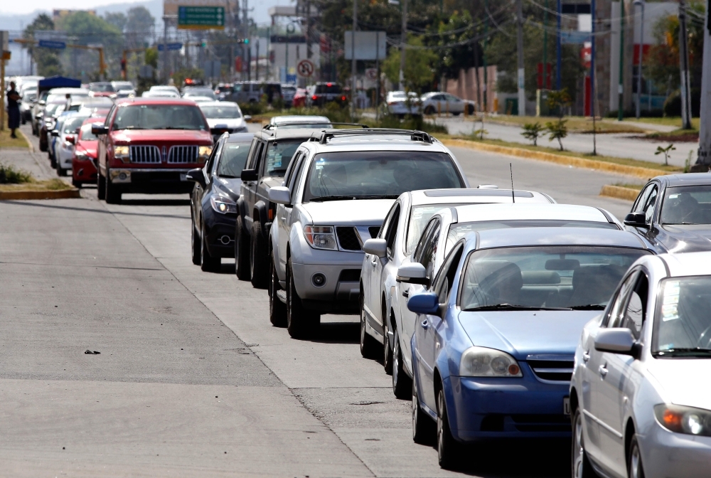 Motorists wait in line to buy gasoline at a Pemex service station in Zapopan, Jalisco state, Mexico, on Sunday. — AFP