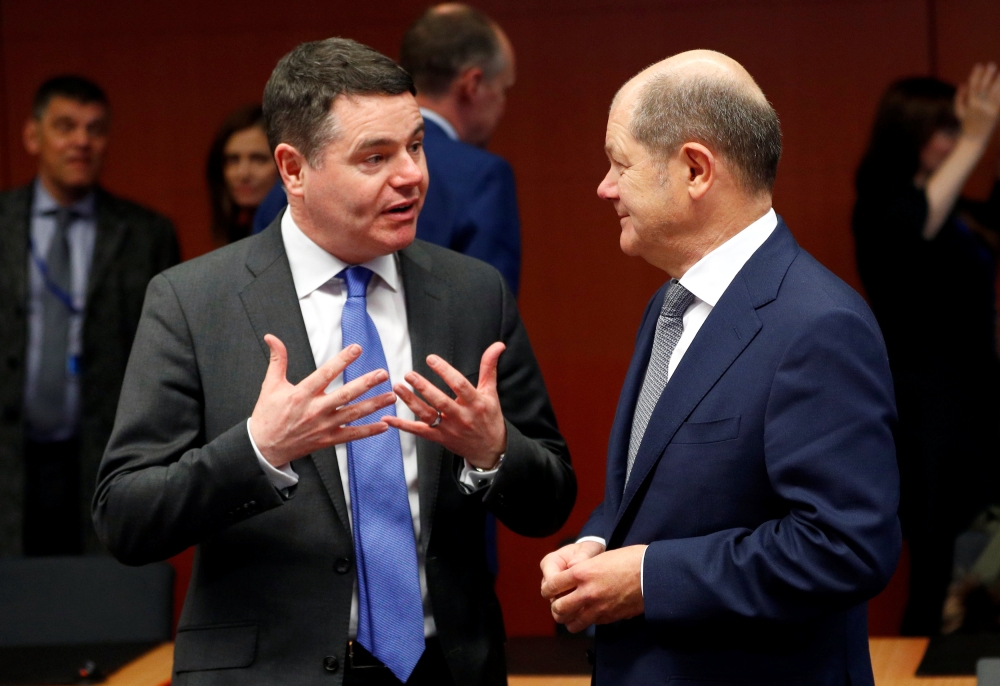 Irish Finance Minister Paschal Donohoe and German Finance Minister Olaf Scholz attend a eurozone finance ministers meeting in Brussels, Belgium, on Monday. — Reuters