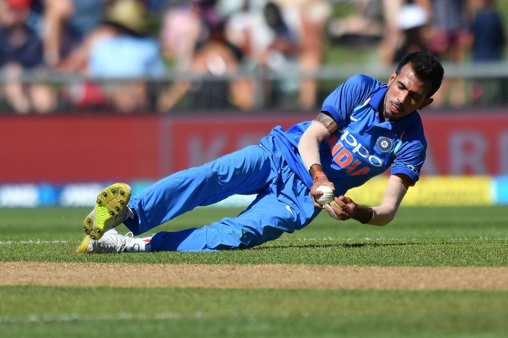 India’s Yuzvendra Chahal takes the catch of New Zealand’s Tom Latham during the first One-Day International cricket match at McLean Park in Napier Wednesday. — AFP 