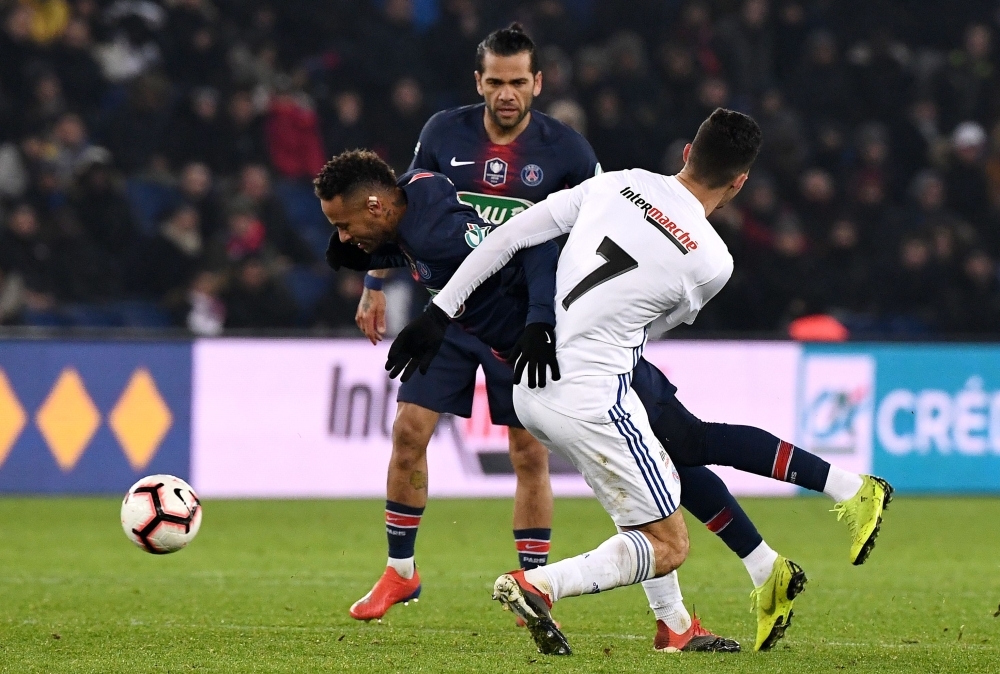 Paris Saint-Germain's Brazilian forward Neymar is tackled by Strasbourg's Tunisian midfielder Moataz Zemzemi during the French Cup round of 32 football match at the Parc des Princes stadium in Paris on Wednesday. Neymar has suffered a fresh injury to his right metatarsal, three weeks ahead of the first leg of PSG's crunch Champions League clash against Manchester United. — AFP