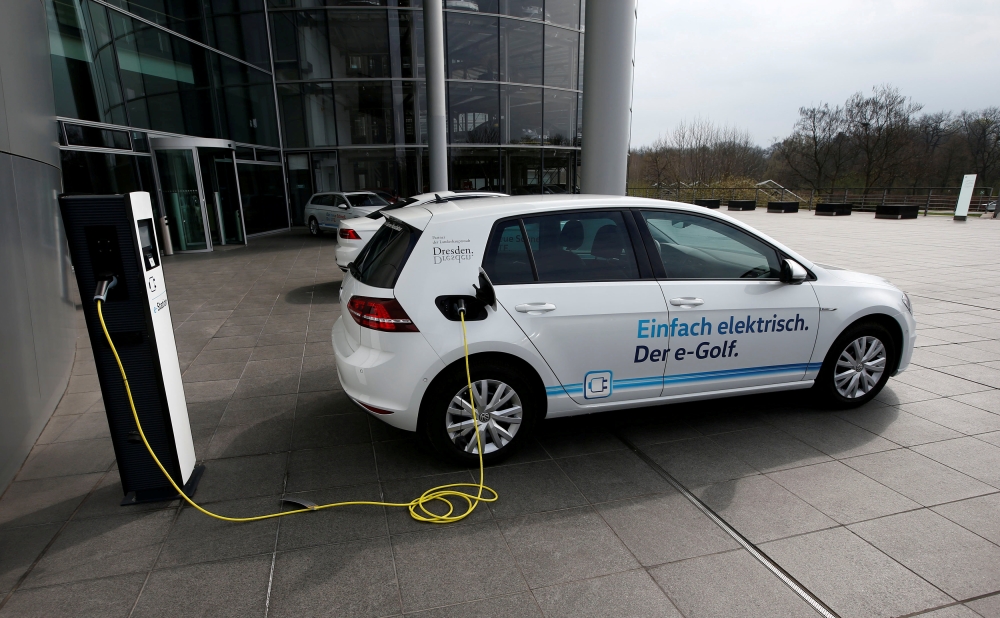 An e-Golf electric car is pictured charging outside the new production line of the Transparent Factory of German carmaker Volkswagen in Dresden, Germany, in this file photo. — Reuters