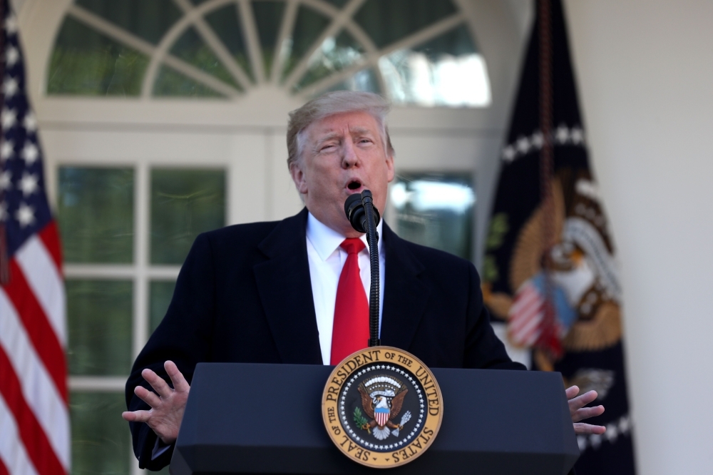 US President Donald Trump speaks about the government shutdown on Friday, from the Rose Garden of the White House in Washington, DC. Trump says will sign bill to reopen the government until Feb. 15. — AFP