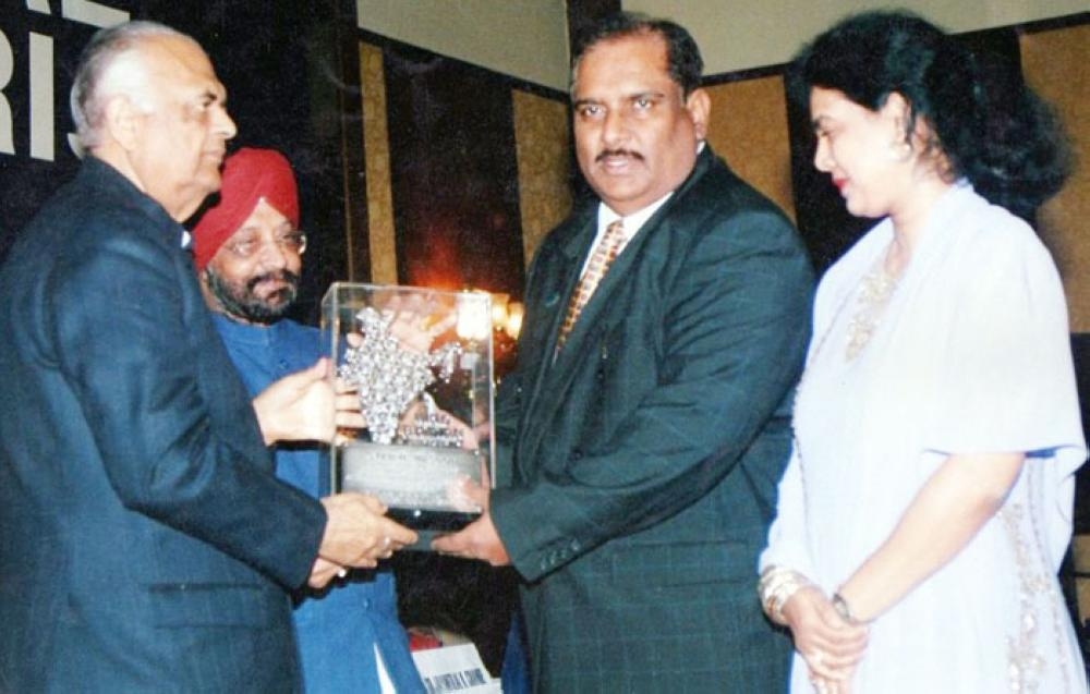 Mr & Mrs Masood receiving Hind Rattan Award from K.C. Pant, Ex-Defense Minister of India