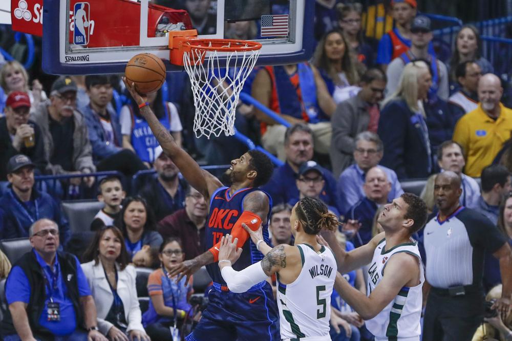 Oklahoma City Thunder’s forward Paul George goes to the basket against Milwaukee Bucks during their NBA game at Chesapeake Energy Arena in Oklahoma City Sunday. — Reuters