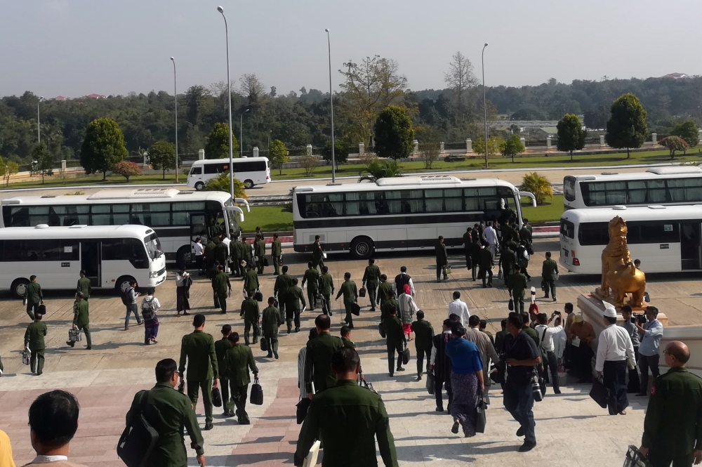 Military members of parliament leave the Union Parliament in Napyidaw, Myanmar, on Tuesday. — Reuters