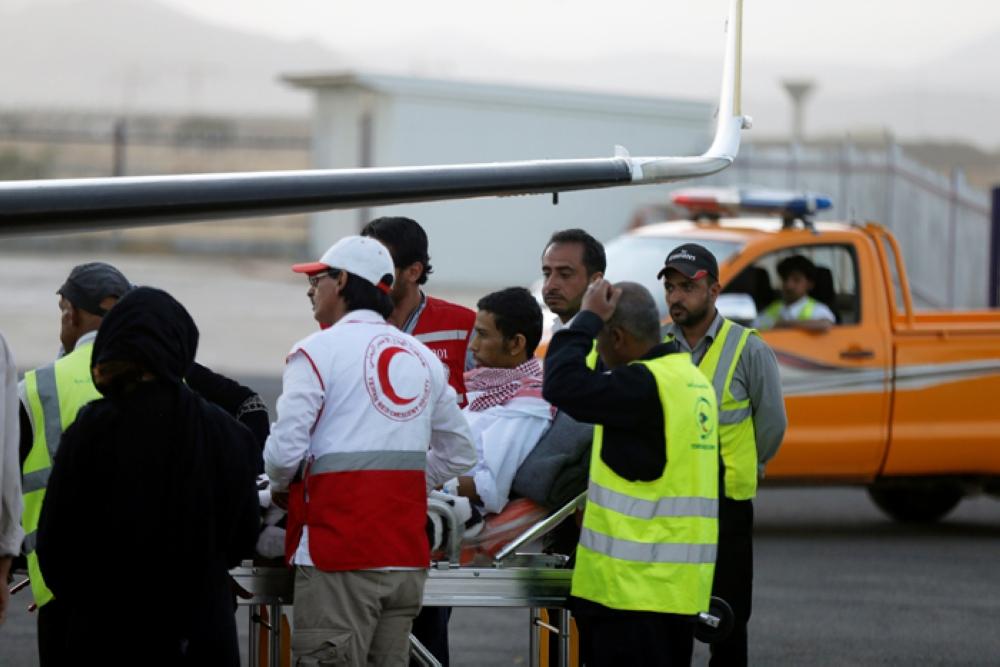 Saudi prisoner Moussa Awaji is taken on a stretcher to an ICRC plane at Sanaa airport after he was released by the Houthis in Sanaa. — Reuters