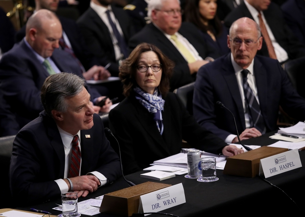 (L-R) FBI Director Christopher Wray; CIA Director Gina Haspel; and Director of National Intelligence Dan Coats testify at a Senate Intelligence Committee hearing on 