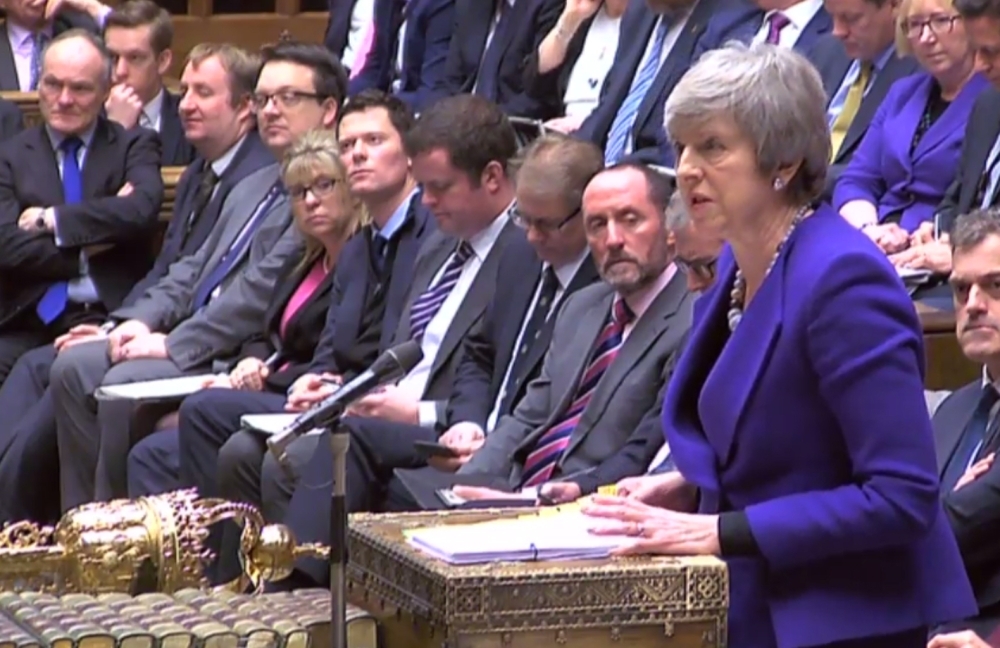 A video grab from footage broadcast by the UK Parliament's Parliamentary Recording Unit (PRU) shows Britain's Prime Minister Theresa May as she speaks during the weekly Prime Minister's Questions (PMQs) in the House of Commons in London on Wednesday. — AFP