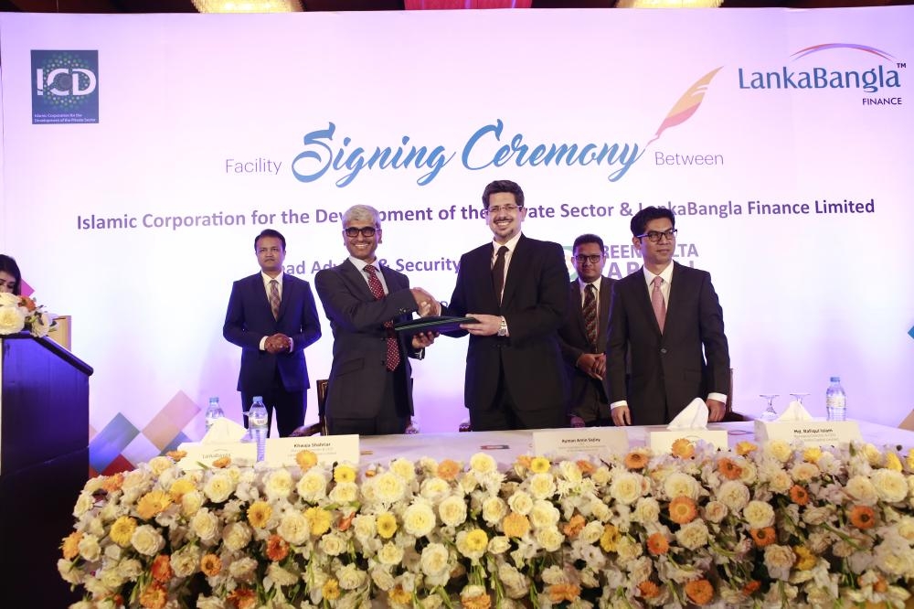 Ayman Amin Sejiny, CEO & general manager of ICD, center, and Khwaja Shahriar, managing director of LankaBangla Finance Limited, signed the facility agreement on behalf of their respective organizations on Tuesday in Dhaka, Bangladesh. — Courtesy photo