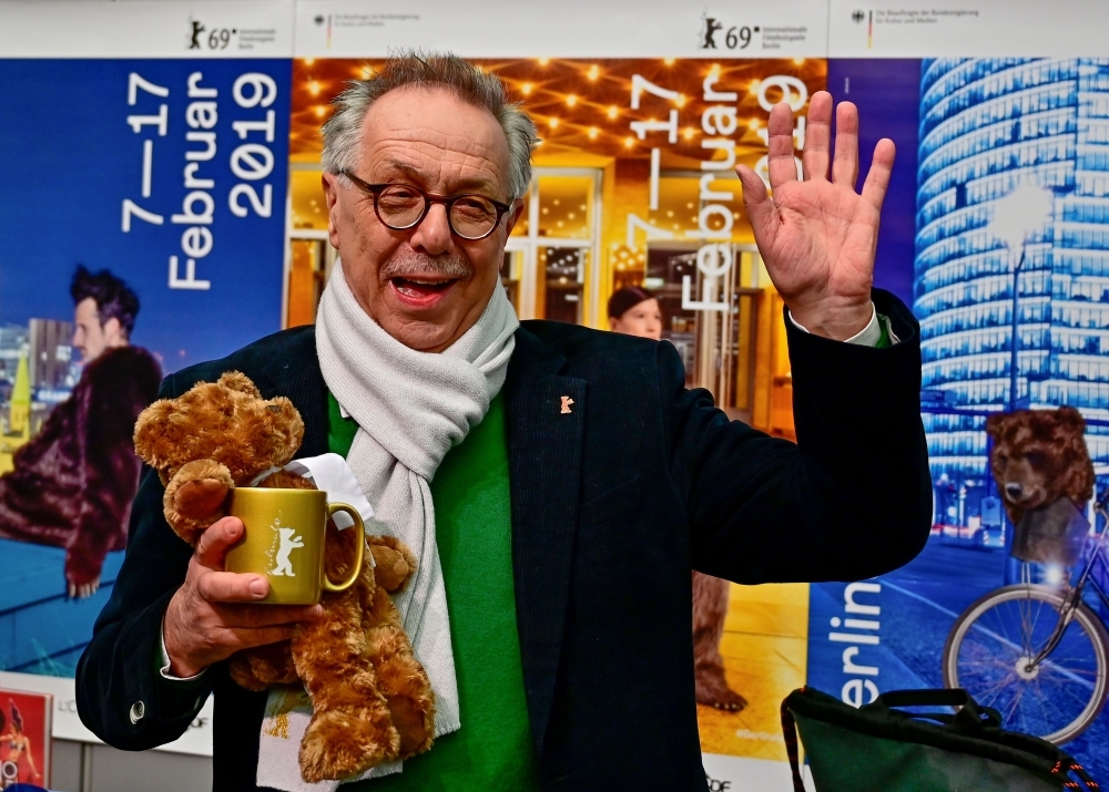 Outgoing Berlinale director Dieter Kosslick poses with Berlinale paraphernalia before giving a press conference in Berlin to present the program of the 69th Berlin film festival. — AFP