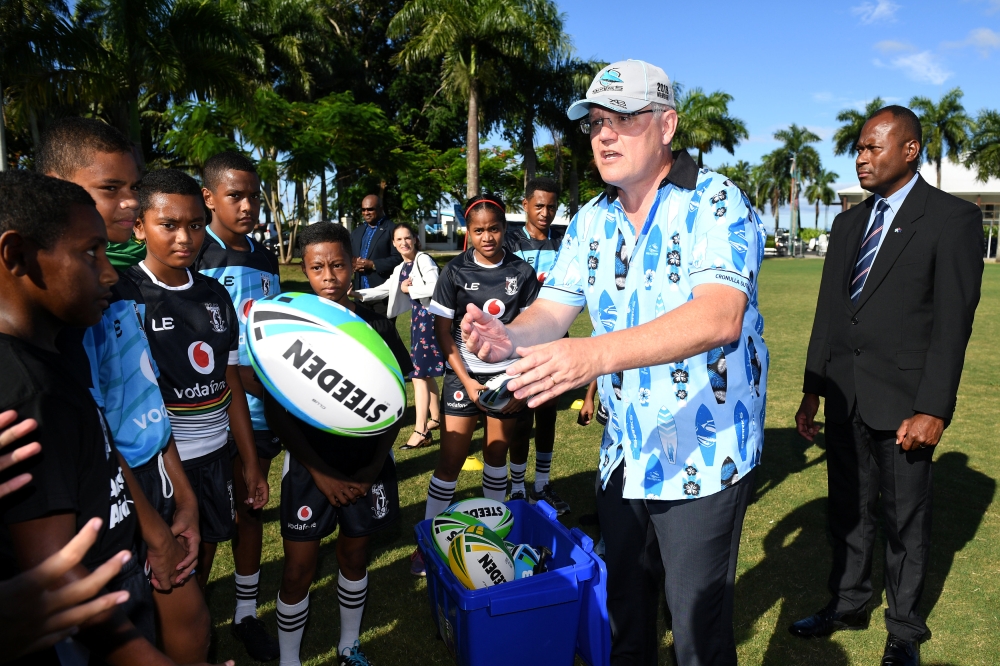 Australian Prime Minister Scott Morrison meets with young rugby league players in Suva, Fiji. — Reuters