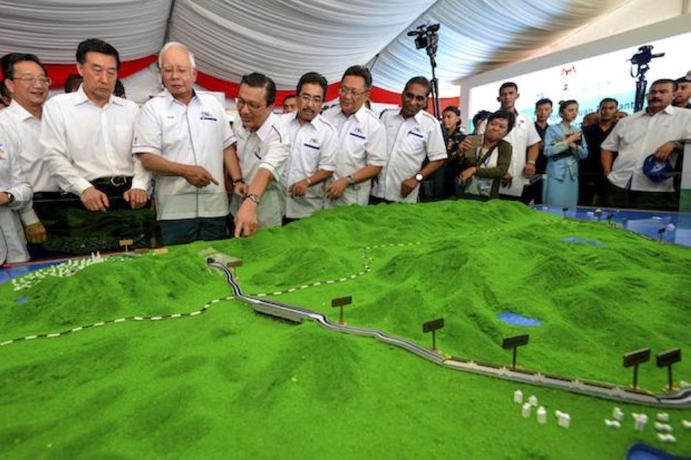 File photo shows, former Malaysian Prime Minster Najib Razak (third from left) inspects a model of the East Coast Rail Link during the project’s launch in Kuantan in 2017.