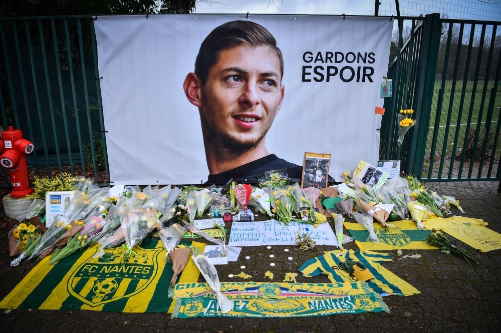 Nantes supporters hold up a banner that reads, 'With you' and showing the image of Nantes' Argentinian forward Emilianio Sala, who is missing following a plane crash, during the French L1 football match between FC Nantes and AS Saint Etienne (ASSE) at the La Beaujoire stadium in Nantes, western France on Wednesday. — AFP