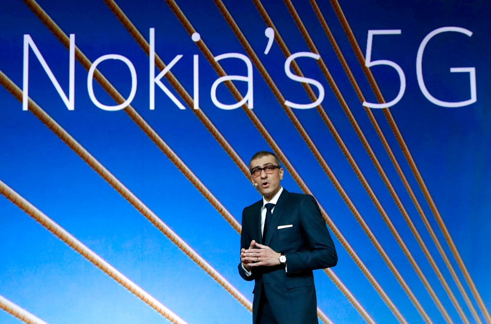 Rajeev Suri, Nokia's president and chief executive officer, speaks during the Mobile World Congress in Barcelona, Spain, in this file photo. — Reuters