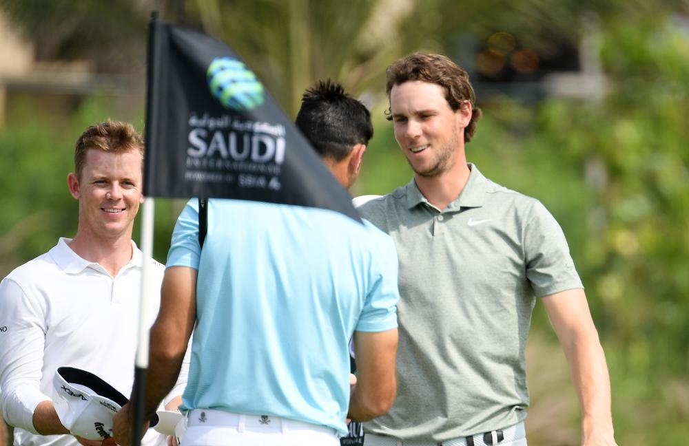 Brandon Stone of South Africa, Alvaro Quiros of Spain and Thomas Pieters of Belgium on the 9th green during the first round of the Saudi International at the Royal Greens Golf & Country Club on Thursday in King Abdullah Economic City, Saudi Arabia. — Getty Images