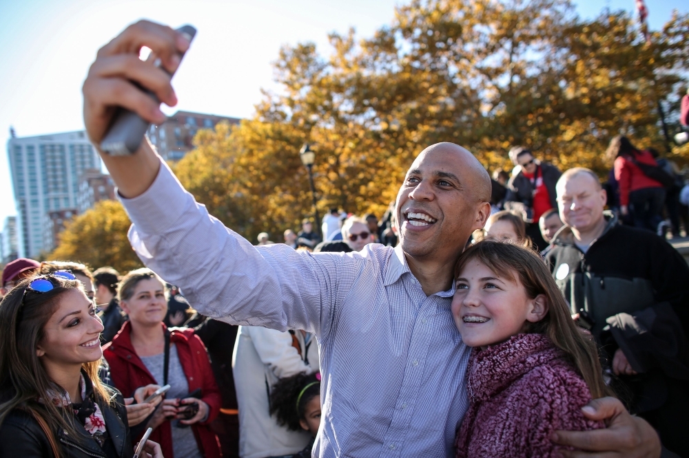 US Senator Cory Booker takes a selfie during a rally in support of US Senator Bob Menendez in Hoboken, New Jersey, in this Nov. 4, 2018 file photo. — AFP