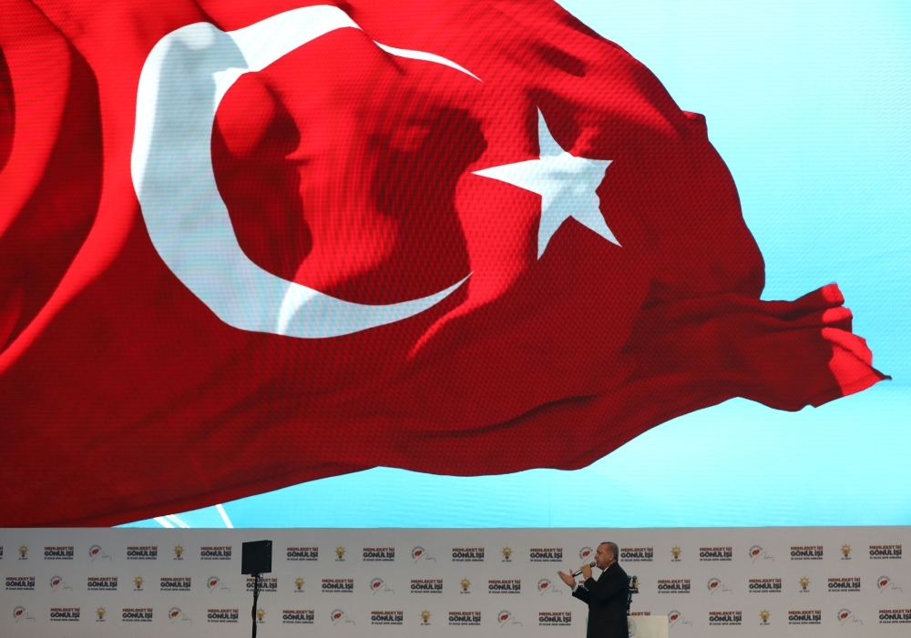 Turkish President Recep Tayyip Erdogan makes a speech during AK party’s presentation of mayoral candidates for upcoming March 31 local elections at the Ankara Sports Hall in Ankara.  AFP