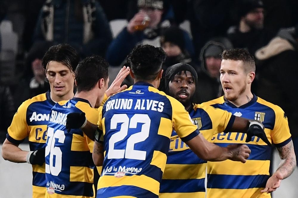 Parma’s forward Gervinho (2nd R) celebrates with his teammates after scoring during the Italian Serie A football match against Juventus at the Juventus Stadium in Turin Saturday. — AFP 