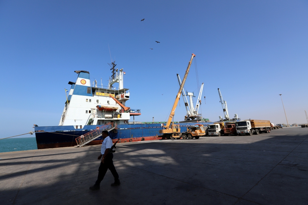 A coast guard walks past a ship docked at the Red Sea port of Hodeida on Jan. 5, 2019.— Reuters