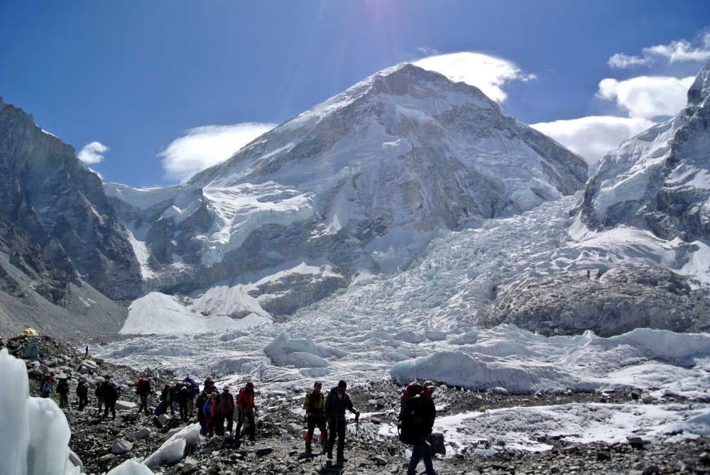 Climbers walk towards their helicopter (not seen) after their Mount Everest expeditions were canceled in Solukhumbu district in this file photo. — Reuters