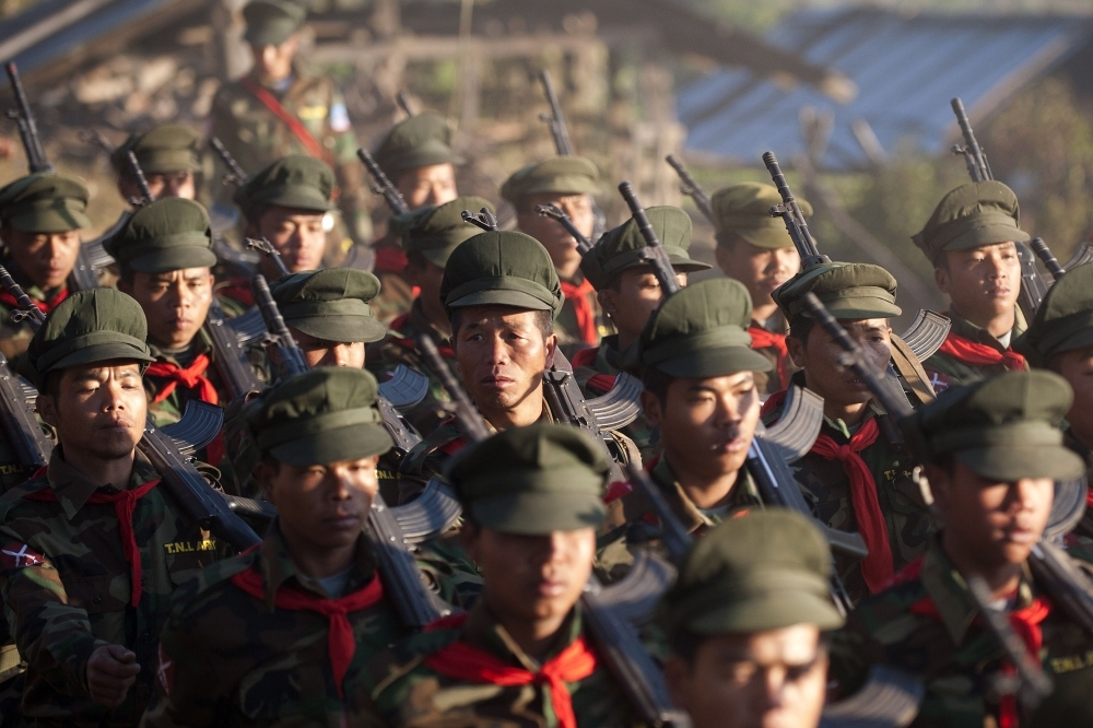 This file photo shows soldiers from the Taaung National Liberation Army (TNLA), a Palaung ethnic armed group, parading as they mark the 51st anniversary of the Taaung National Resistance Day at Homain, Nansan township in Myanmar's northern Shan state. Facebook has blacklisted four more of Myanmar's ethnic rebel groups, including Taaung National Liberation Army (TNLA), the platform announced Tuesday as it struggles to control rampant hate speech, misinformation and incitement on its platform. — AFP