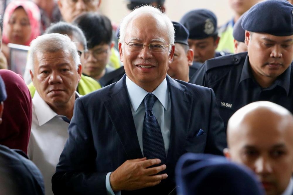 Disgraced former Malaysian Prime Minister Najib Razak, seen in this file photo, is using a charm offensive prior to his graft case. — Reuters