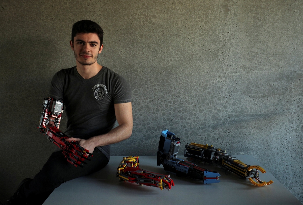 David Aguliar poses with his prosthetic arm built with Lego pieces during an interview with Reuters in Sant Cugat del Valles, near Barcelona, Spain. — Reuters