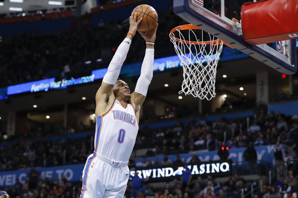 Oklahoma City Thunder guard Russell Westbrook (0) dunks against the Memphis Grizzlies during the second half at Chesapeake Energy Arena. Oklahoma City won 117-95. — Reuters