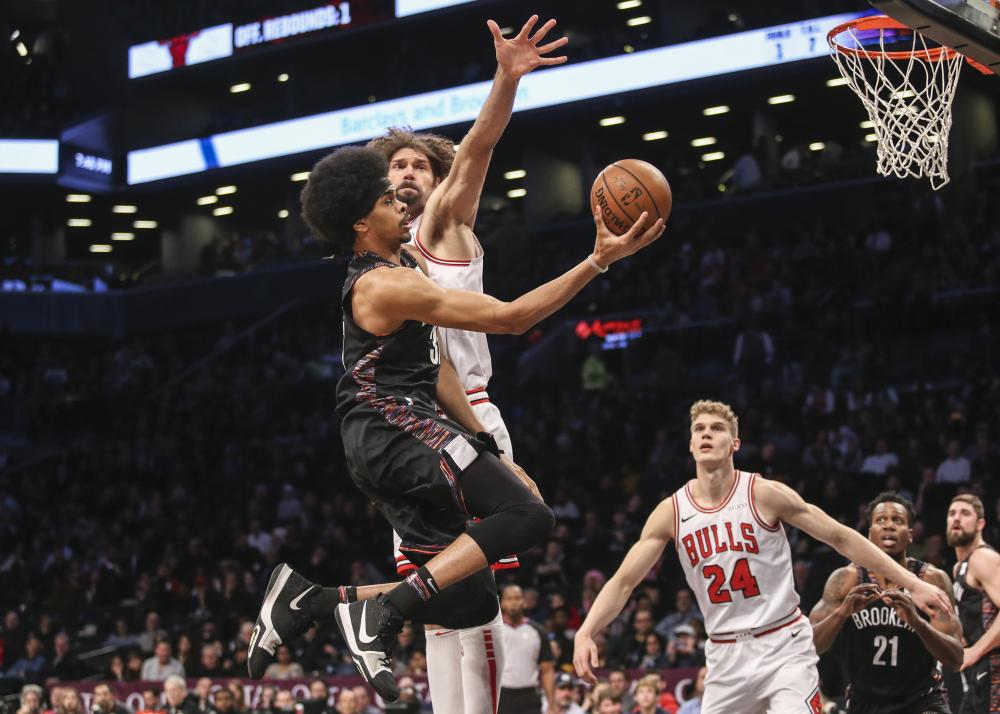 Brooklyn Nets’ center Jarrett Allen shoots the ball as Chicago Bulls’ center Robin Lopez defends during their NBA game at Barclays Center in Brooklyn Friday. — Reuters