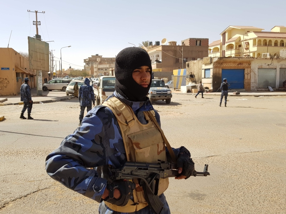 Forces loyal to Libyan strongman Khalifa Haftar patrol in the southern Libyan city of Sebha, on Saturday. — AFP 