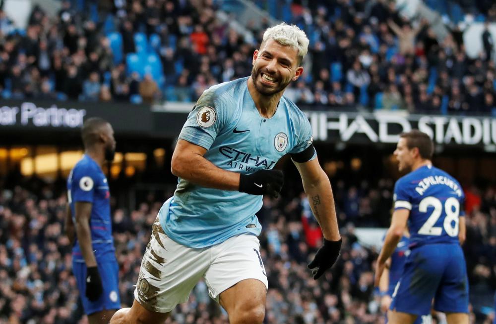 Manchester City's hat trick hero Sergio Aguero celebrates scoring against Chelsea during their English Premier League match at Etihad Stadium, Manchester, Sunday. — Reuters