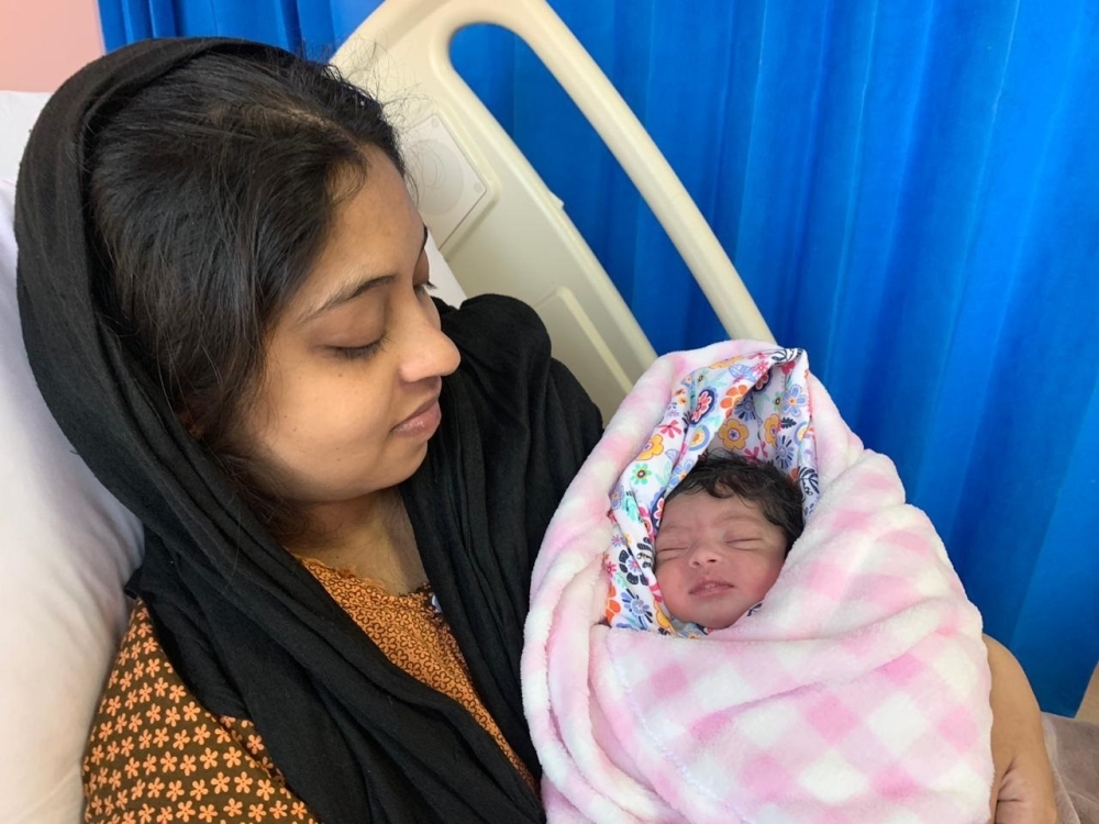 


Tintu Stephen and her newborn girl at the Abha Maternity Hospital.