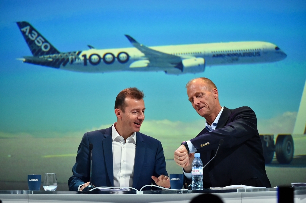 Airbus Executive Chairman Tom Enders (R) and the President of Airbus Commercial Aircraft Business Guillaume Faury hold a press conference to announce the annual results of the company, in Blagnac. European aerospace giant Airbus said Thursday it would end production of the A380 superjumbo, the double-decker jet which earned plaudits from passengers but failed to win over enough airlines to justify its massive costs. — AFP